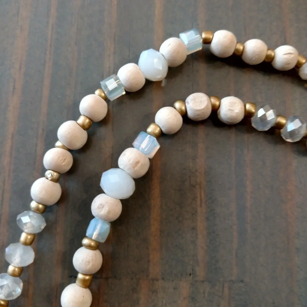 Wood, bead, crystal, and suede tassel necklace